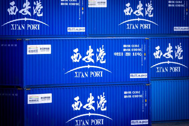 FILED - 11 February 2022, Mecklenburg-Western Pomerania, Mukran: Containers from Chinese logistics companies stand on the grounds of the seaport of Mukran as part of a new "Silk Road" connection between China and Germany. China's exports rebounded in November after a surprising fall the previous month, while imports grew at a slower pace, customs data showed on Monday. Photo: Jens Büttner/dpa-Zentralbild/dpa