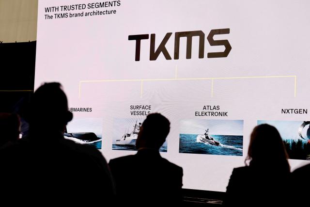 FILED - 04 June 2025, Schleswig-Holstein, Kiel: Visitors to a press conference sit in front of a screen at Thyssenkrupp Marine Systems (TKMS). Photo: Frank Molter/dpa
