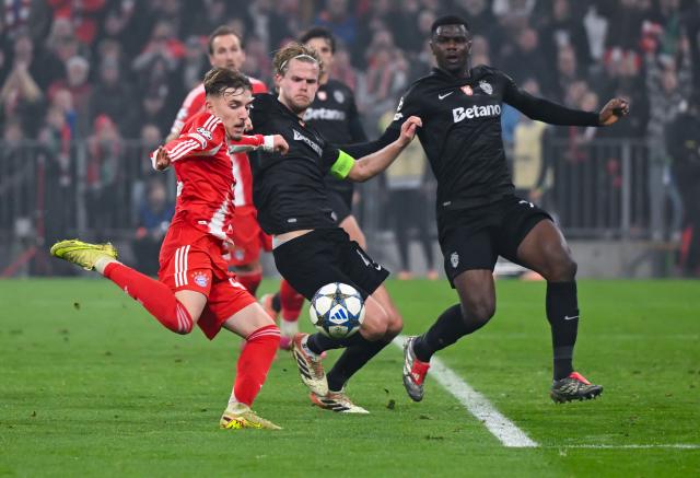 09 December 2025, Bavaria, Munich: Bayern Munich's Lennart Karl (L) scores his side's second goal during the UEFA Champions League soccer match between Bayern Munich and Sporting Lisbon at the Allianz Arena. Photo: Sven Hoppe/dpa