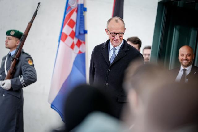 10 December 2025, Berlin: German Chancellor Friedrich Merz awaits the Prime Minister of the Republic of Croatia in front of the Federal Chancellery. Photo: Kay Nietfeld/dpa