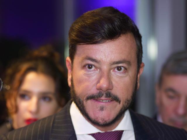 FILED - 27 October 2021, Hesse, Frankfurt_Main: Rene Benko, then head of the Austrian Signa Group, stands in the audience at the grand opening of a Galeria department store. Photo: Frank Rumpenhorst/dpa