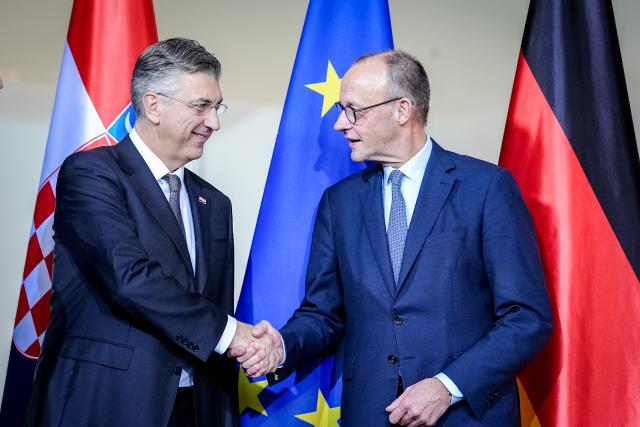 10 December 2025, Berlin: German Chancellor Friedrich Merz (R) shakes hands with the Prime Minister of the Republic of Croatia, Andrej Plenkovic, during their joint press conference at the Federal Chancellery in Berlin. Photo: Kay Nietfeld/dpa