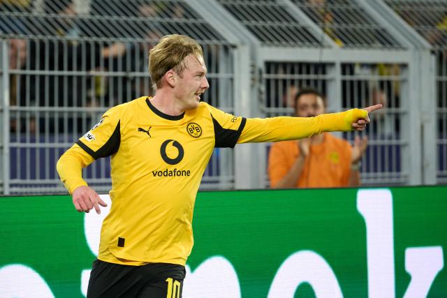 10 December 2025, North Rhine-Westphalia, Dortmund: Borussia Dortmund's Julian Brandt celebrates scoring his side's first goal during the UEFA Champions League soccer match between Borussia Dortmund and FK Bodoe/Glimt at Signal Iduna Park. Photo: Bernd Thissen/dpa