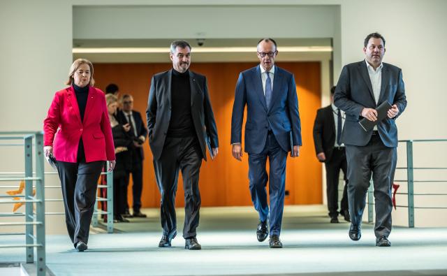 11 December 2025, Berlin: German Chancellor Friedrich Merz (2-R), Lars Klingbeil (R), German Minister of Finance, Baerbel Bas, Minister of Labor and Social Affairs, and Markus Soeder, Minister President of Bavaria and CSU Chairman, arrive at the press briefing on the results of the consultations following the coalition committee in the Chancellery. Photo: Michael Kappeler/dpa