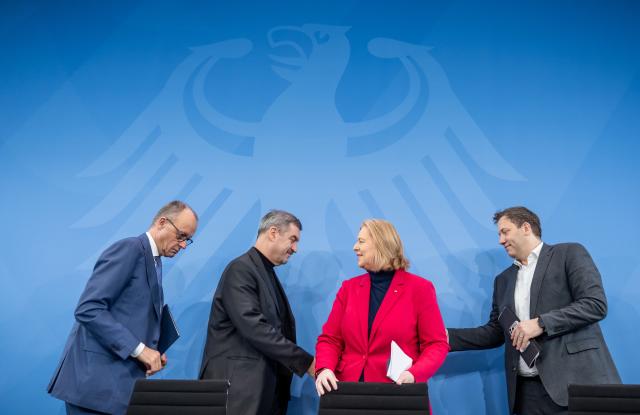 12 November 2025, Berlin: German Chancellor Friedrich Merz (L), Lars Klingbeil (R), German Minister of Finance, Baerbel Bas, German Minister of Labor and Social Affairs, and Markus Soeder, Minister President of Bavaria and CSU Chairman, take part in the press briefing on the results of the consultations following the coalition committee in the Chancellery. Photo: Michael Kappeler/dpa