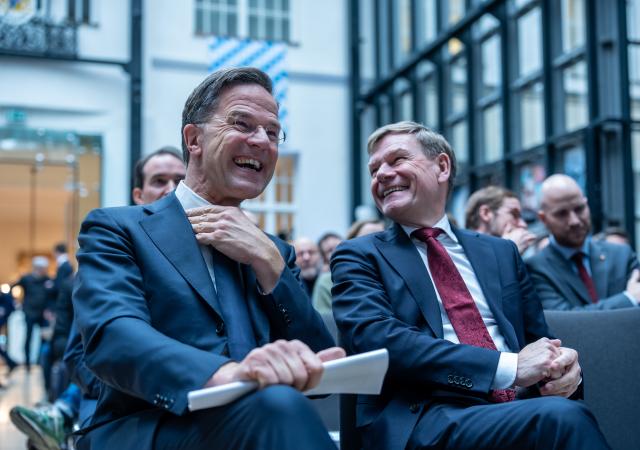 11 December 2025, Berlin: NATO Secretary General Mark Rutte (L) laughs next to Johann Wadephul, German Foreign Minister, before his keynote speech at the invitation of the Munich Security Conference in the rooms of the Bavarian State Representation. Photo: Michael Kappeler/dpa