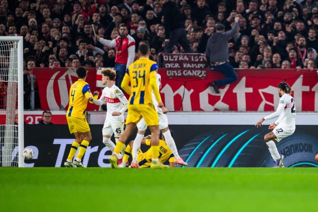 11 December 2025, Baden-Wuerttemberg, Stuttgart: Stuttgart's Lorenz Assignon (R) scores his side's first goal of the game during the UEFA Europa League soccer match between VfB Stuttgart and Maccabi Tel Aviv at MHPArena. Photo: Tom Weller/dpa