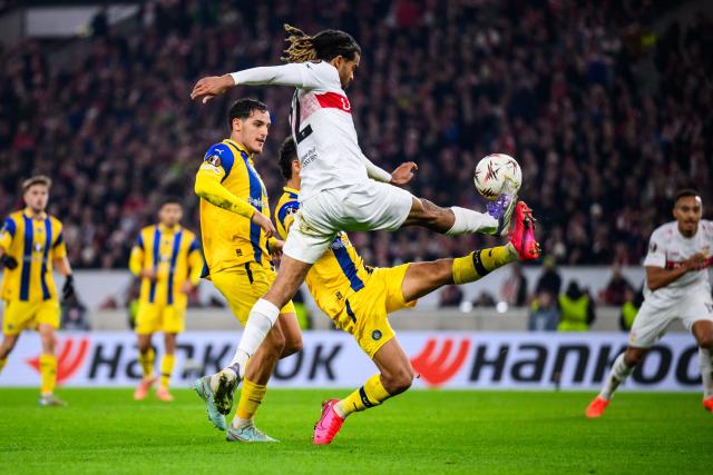 11 December 2025, Baden-Wuerttemberg, Stuttgart: Stuttgart's Lorenz Assignon (R) and Maccabi Tel Aviv's Roy Revivo (R) battle for the ball during the UEFA Europa League soccer match between VfB Stuttgart and Maccabi Tel Aviv at MHPArena. Photo: Tom Weller/dpa