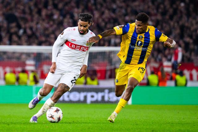 11 December 2025, Baden-Wuerttemberg, Stuttgart: Stuttgart's Lorenz Assignon and Maccabi Tel Aviv's Helio Varela (R) battle for the ball during the UEFA Europa League soccer match between VfB Stuttgart and Maccabi Tel Aviv at MHPArena. Photo: Tom Weller/dpa