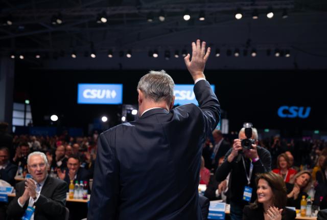 12 December 2025, Bavaria, Munich: Christian Social Union in Bavaria (CSU) Chairman and Minister President of Bavaria Markus Soeder waves upon his arrival to attend the CSU party conference in the exhibition hall. Photo: Sven Hoppe/dpa
