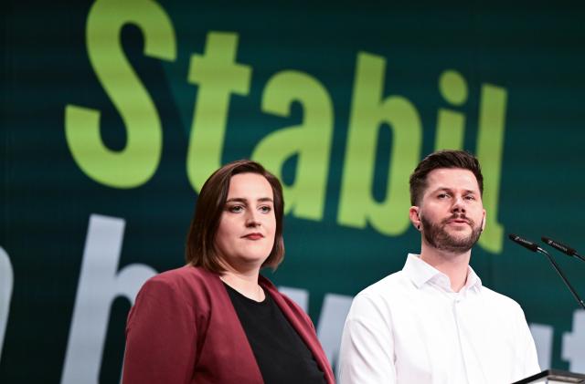 12 December 2025, Baden-Wuerttemberg, Ludwigsburg: Lena Schwelling (L) and Pascal Haggenmüller, the state board members of the Alliance 90/The Greens (Bündnis 90/Die Grünen) Baden-Wuerttemberg party, stand on the podium at the state party conference. Photo: Bernd Weißbrod/dpa