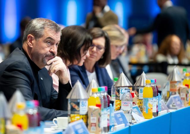 13 December 2025, Bavaria, Munich: Markus Soeder (l), CSU Chairman and Minister President of Bavaria, attends the CSU party conference in the exhibition hall. Photo: Sven Hoppe/dpa