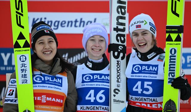 13 December 2025, Saxony, Klingenthal: Nika Prevc (C) from Slovenia wins ahead of Nozomi Maruyama (L) from Japan and Anna Odine Strom from Norway the women's large hill competition of the FIS Ski Jumping World Cup. Photo: Hendrik Schmidt/dpa