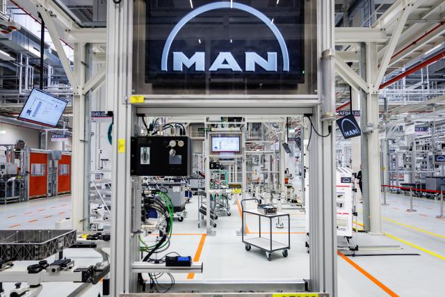 FILED - 11 April 2025, Bavaria, Nuremberg: A view of the production hall at the plant of truck and bus manufacturer MAN at the start of battery production for electric engines on a driverless transport system. Photo: Daniel Karmann/dpa