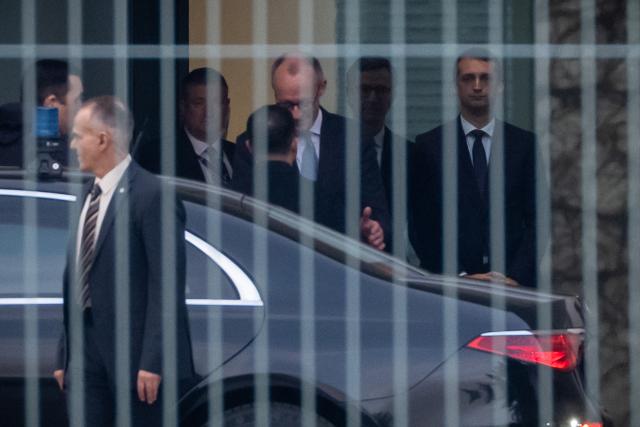14 December 2025, Berlin: German Chancellor Friedrich Merz (C) welcomes Ukrainian President Volodymyr Zelensky ahead of Ukraine talks at the German Chancellery. US representatives are in Berlin to discuss a possible ceasefire with Ukrainian and European officials. Photo: Michael Kappeler/dpa