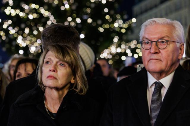 14 December 2025, Berlin: German President Frank-Walter Steinmeier and Elke Büdenbender attend the ceremony to light the first candle of the Hanukkah menorah on Pariser Platz in front of the Brandenburg Gate, marking the start of the Jewish festival of lights. Following the deadly attack on a Hanukkah celebration of the Chabad community at Bondi Beach in Sydney, they called for prayer. Photo: Carsten Koall/dpa
