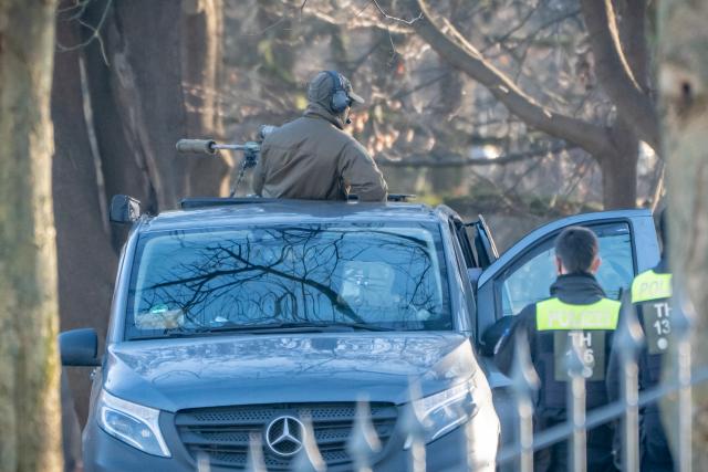 15 December 2025, Berlin: A police sniper has taken up position in front of Bellevue Palace, on the second day of consultations on a possible peace in Ukraine in Berlin. Photo: Michael Kappeler/dpa