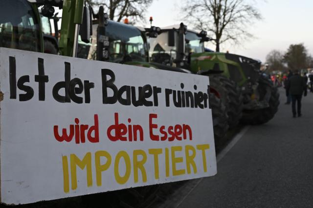 15 December 2025, Baden-Wuerttemberg, Bad Wimpfen: Farmers gather with their tractors outside Lidl's headquarters as part of a nationwide protest against persistently low milk and butter prices, calling for fairer returns for agricultural producers. Photo: Katharina Kausche/dpa