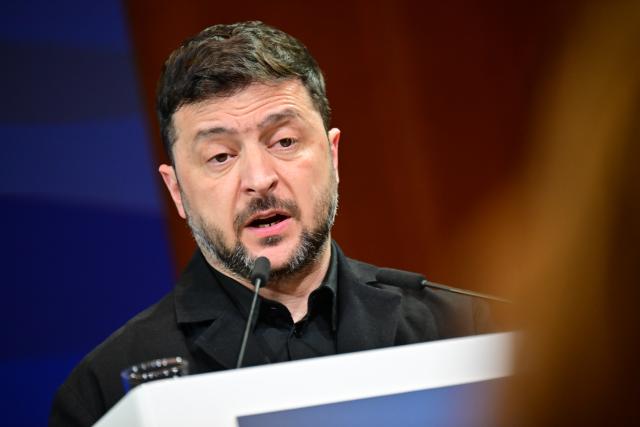 15 December 2025, Berlin: Ukrainian President Volodymyr Zelensky speaks during the German-Ukrainian Business Forum. At the same time, the German government is hosting delegations from the United States and Ukraine for talks on a proposed peace plan, including a possible ceasefire in Ukraine. Photo: Sebastian Christoph Gollnow/dpa