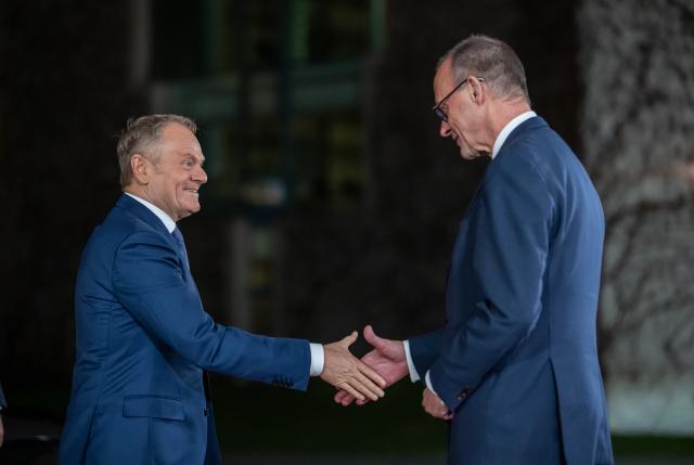 15 December 2025, Berlin: Germany's Chancellor Friedrich Merz (R) welcomes Polish Prime Minister Donald Tusk at the Chancellery. Discussions on a possible peace in Ukraine are taking place in Berlin. Photo: Michael Kappeler/dpa