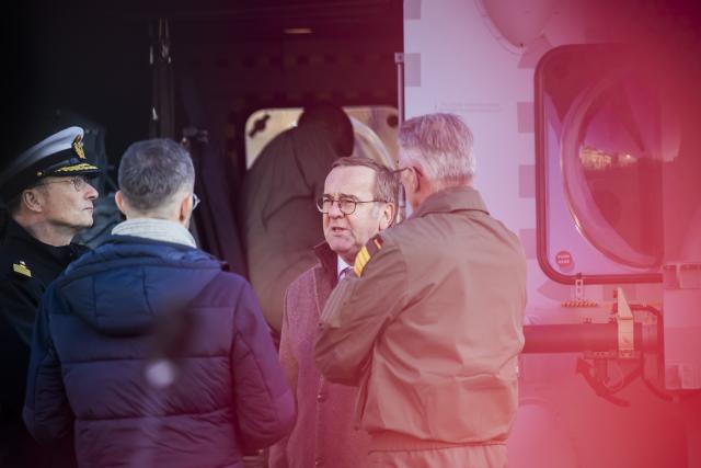 16 December 2025, Berlin: German Minister of Defense Boris Pistorius, talks to Vice Admiral Axel Deertz (L), Deputy Chief of Naval Operations, and Broder Nielsen (R), Commander of Naval Aviation during the handover of the first new NH90 Sea Tiger helicopter to the German Navy at the German Ministry of Defense in Berlin. The Bundeswehr has ordered 31 of the new on-board helicopters, which can also be used in combat against submarines and ships. Photo: Christoph Soeder/dpa