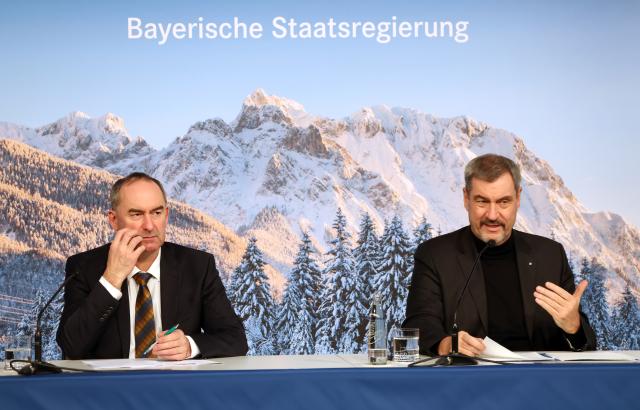 16 December 2025, Bavaria, Munich: Hubert Aiwanger (L), Bavarian Minister of Economic Affairs and Markus Soeder, Bavarian Minister President, sit together at a press conference. Photo: Karl-Josef Hildenbrand/dpa