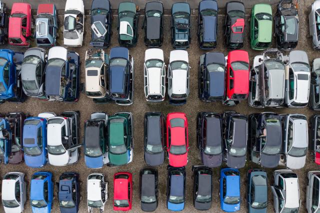 FILED - 07 October 2025, Saxony, Dresden: Scrap vehicles with combustion engines are stacked on top of each other on the premises of a car recycling plant. Photo: Sebastian Kahnert/dpa