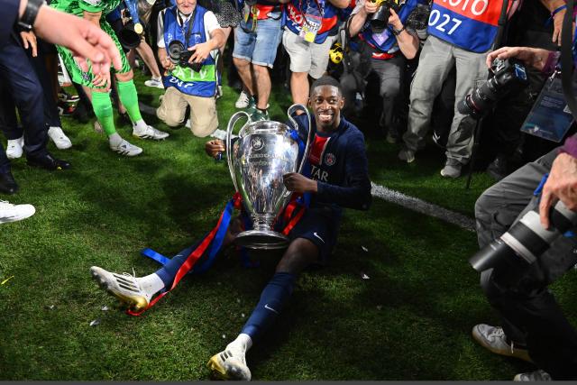 FILED - 31 May 2025, Bavaria, Munich: PSG's Ousmane Dembele celebrates with the Champions League trophy. Paris Saint-Germain forward Ousmane Dembélé and Spain star Aitana Bonmatí won the FIFA Best player awards for 2025 on Tuesday following a vote. Photo: Robert Michael/dpa