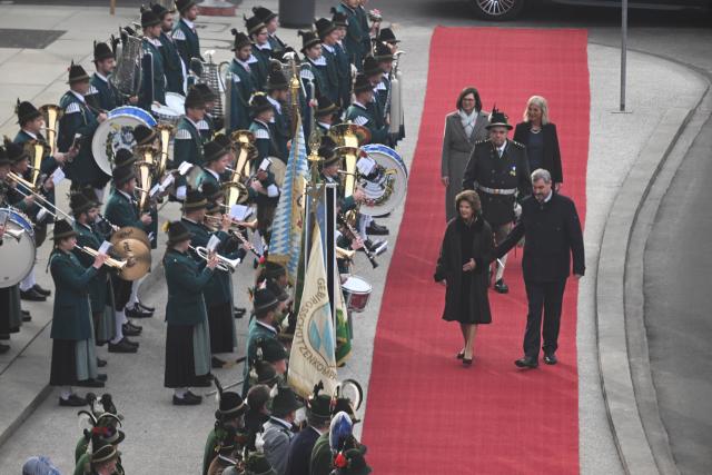 17 December 2025, Bavaria, Munich: Queen Silvia of Sweden is received by Bavaria's Prime Minister Markus Soeder on her arrival. Soeder awards the Bavarian State Medal for Social Merit to Queen Silvia. Photo: Felix Hörhager/dpa