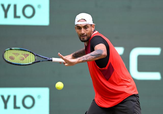 FILED - 18 June 2022, North Rhine-Westphalia, Halle: Australian tennis player Nick Kyrgios in action against Polish Hubert Hurkacz during their men's singles Semi-final match at the Halle Open tennis tournament at the Owl Arena. Photo: David Inderlied/dpa