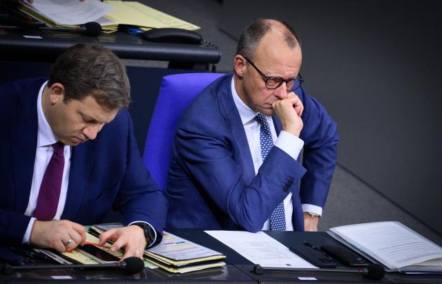 17 December 2025, Berlin: Lars Klingbeil, Germany's Minister of Finance, and Chancellor Friedrich Merz sit during the 49th plenary session of the 21st legislative period in the German Bundestag. Photo: Bernd von Jutrczenka/dpa