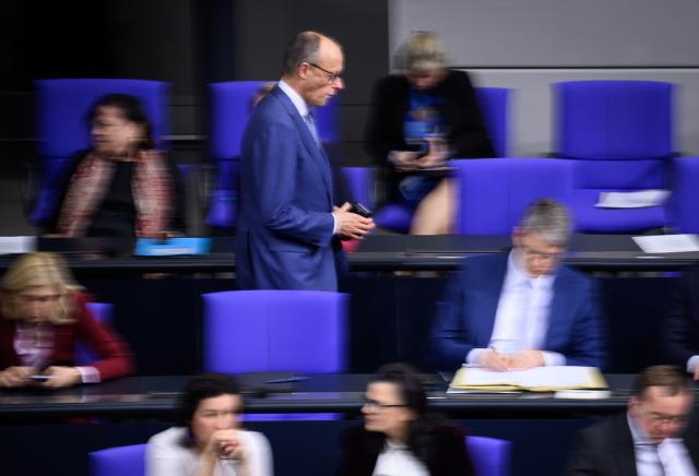 17 December 2025, Berlin: Germany's Chancellor Friedrich Merz returns to his seat during the 49th plenary session of the 21st legislative period in the German Bundestag. Photo: Bernd von Jutrczenka/dpa