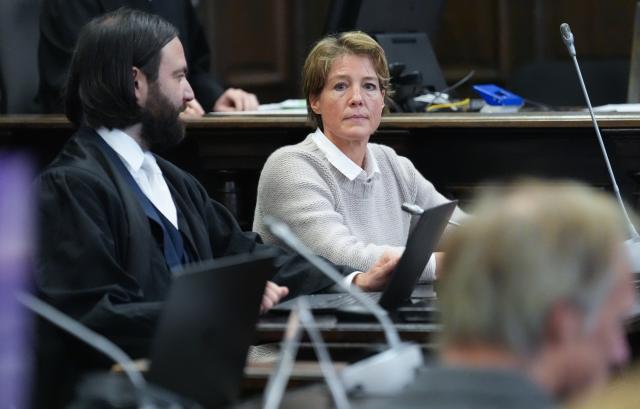 18 December 2025, Hamburg: Christina Block (back;r), German restaurateur and entrepreneur, sits next to lawyer Ingo Bott (l), Block's defense attorney, in the courtroom at the start of the trial for alleged child abduction in Hamburg district court. Gerhard Delling, former television presenter and sports journalist, sits in the foreground on the right. In a cloak-and-dagger operation on New Year's Eve 2023/24, two children of the catering entrepreneur Block were taken from Denmark to Germany. The trial for the alleged kidnapping is taking place at Hamburg District Court, including against Block. Photo: Marcus Brandt/Pool dpa/dpa