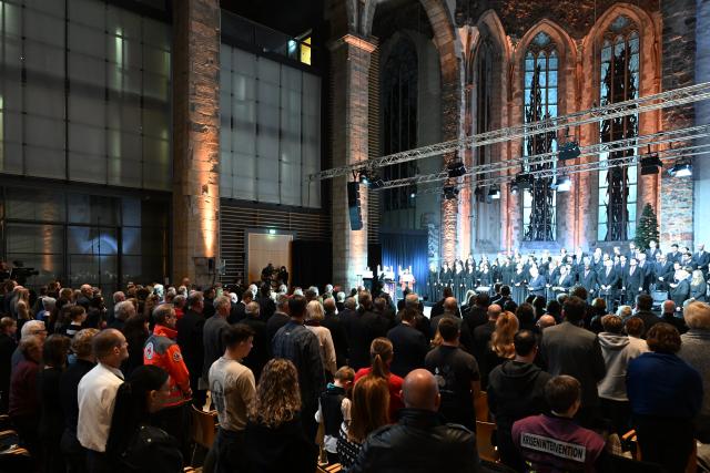20 December 2025, Saxony-Anhalt, Magdeburg: Those affected and bereaved take part in a memorial service at St. John's Church one year after the attack on Magdeburg's Christmas market. On 20 December 2024, a man drove a car into a crowd, killing five women and a child and injuring more than 300 people. Photo: Hendrik Schmidt/dpa
