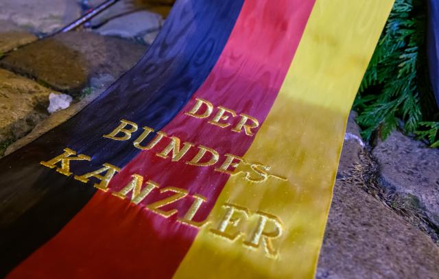 20 December 2025, Saxony-Anhalt, Magdeburg: A wreath from the German Chancellor stands in front of St. John's Church in Magdeburg one year after the attack on the Magdeburg Christmas market, where a memorial service is held earlier. On 20 December 2024, a 50-year-old man drove a rental car into a crowd at the Christmas market, killing a nine-year-old boy and five women and injuring more than 300 people. Photo: Hendrik Schmidt/dpa