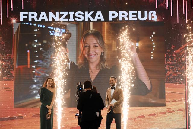 21 December 2025, Baden-Wuerttemberg, Baden-Baden: Presenters Lena Kesting and Sven Voss as German biathlete Franziska Preuss is honored as Sportswoman of the Year 2025 during the Sportsman of the Year 2025 gala at the Kurhaus Baden-Baden. Photo: Uli Deck/dpa