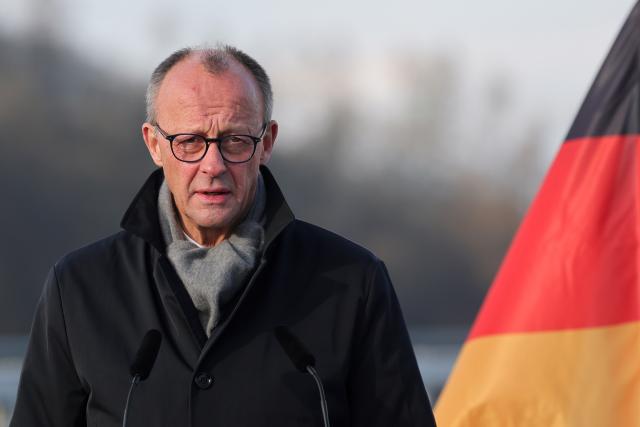 22 December 2025, North Rhine-Westphalia, Lüdenscheid: German Chancellor Friedrich Merz speaks at the opening of the Rahmedetal bridge. The important A45 north-south axis in the Sauerland region was interrupted for almost four years due to a dilapidated bridge. The dilapidated bridge was closed at the beginning of December 2021 and later blown up. Photo: Rolf Vennenbernd/dpa