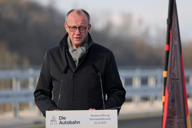 22 December 2025, North Rhine-Westphalia, Lüdenscheid: German Chancellor Friedrich Merz speaks at the opening of the Rahmedetal bridge. The important A45 north-south axis in the Sauerland region was interrupted for almost four years due to a dilapidated bridge. The dilapidated bridge was closed at the beginning of December 2021 and later blown up. Photo: Rolf Vennenbernd/dpa