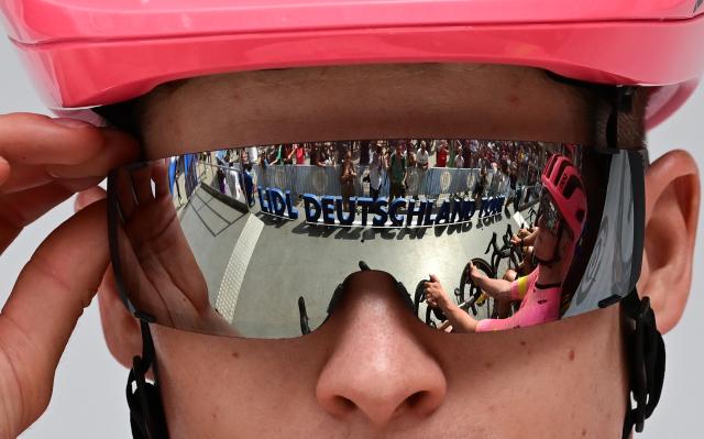 FILED - 23 August 2024, Baden-Württemberg, Heilbronn: The Lidl Deutschlandtour logo is reflected in the sunglasses of German rider Georg Steinhauser from the EF Education - Easypost team before the start in Heilbronn. Photo: Bernd Weißbrod/dpa