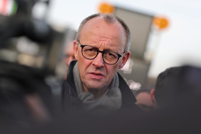 22 December 2025, North Rhine-Westphalia, Lüdenscheid: German Chancellor Friedrich Merz speaks in an interview after the opening of the Rahmedetal bridge. The important A45 north-south axis in the Sauerland region was interrupted for almost four years due to a dilapidated bridge. The dilapidated bridge was closed at the beginning of December 2021 and later blown up. Photo: Rolf Vennenbernd/dpa