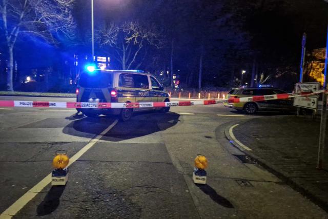 22 December 2025, Hesse, Giessen: Police emergency services close a road in Giessen, where a car is said to have driven into a bus stop and three people are injured. Photo: Carolin Eckenfels/dpa