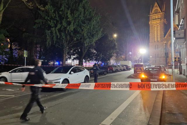 22 December 2025, Hesse, Giessen: Police emergency services close a road in Giessen, where a car is said to have driven into a bus stop and three people are injured. Photo: Carolin Eckenfels/dpa