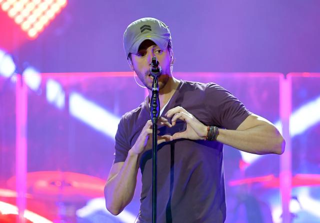 FILED - 05 May 2017, Berlin: Spanish singer Enrique Iglesias preforms on stage during his "sex and love" tour in the Mercedes-Benz Arena. Anna Kournikova and Enrique Iglesias have welcomed their third child. Photo: Britta Pedersen/dpa-Zentralbild/dpa