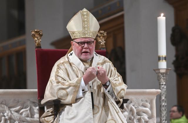 24 December 2025, Bavaria, Munich: Cardinal Reinhard Marx sits in front of the altar during his sermon at the Christmas mass in Munich Cathedral. This Christmas service takes place every year in the Frauenkirche. Photo: Felix Hörhager/dpa