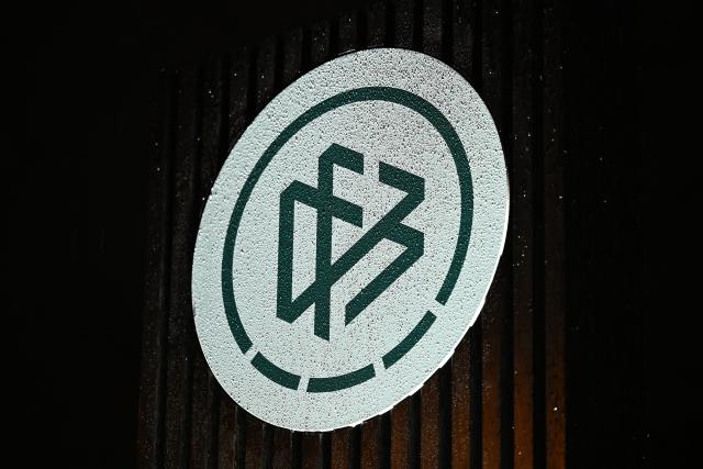 FILED - 10 December 2025, Hesse, Frankfurt/Main: An illuminated logo of the German Football Association (DFB) stands in front of its headquarters. Photo: Michael Brandt/dpa