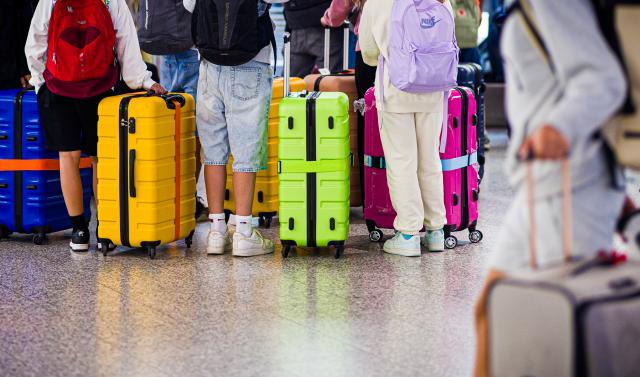 FILED - 03 July 2025, Lower Saxony, Langenhagen: Passengers waiting at Hanover-Langenhagen Airport in the early morning. Photo: Moritz Frankenberg/dpa