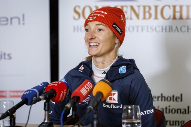 27 December 2025, Bavaria, Fischen Im Allgaeu: German ski jumper Katharina Schmid speaks at a press event before the Four Hills Tournament. The 29-year-old announced at the event that she would be ending her active career after this winter. Photo: Daniel Karmann/dpa
