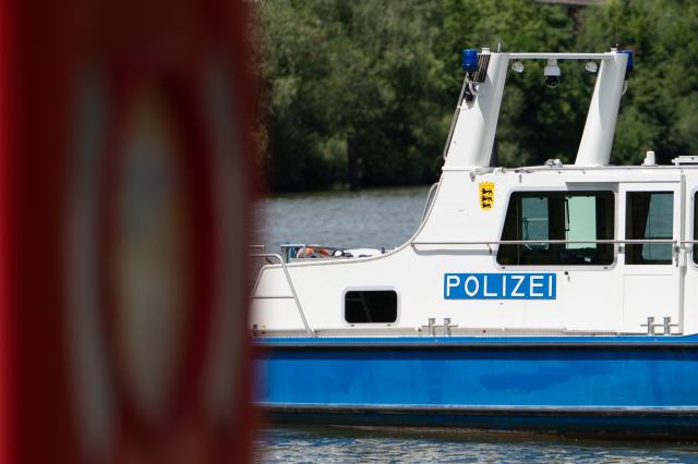 FILED - 17 July 2025, Baden-Württemberg, Stuttgart: A water police vessel sails on the Neckar. Ten people fell into the cold waters of the Rhine river in an accident involving two rowing boats near the southern German city of Mannheim on Sunday. Photo: Markus Lenhardt/dpa