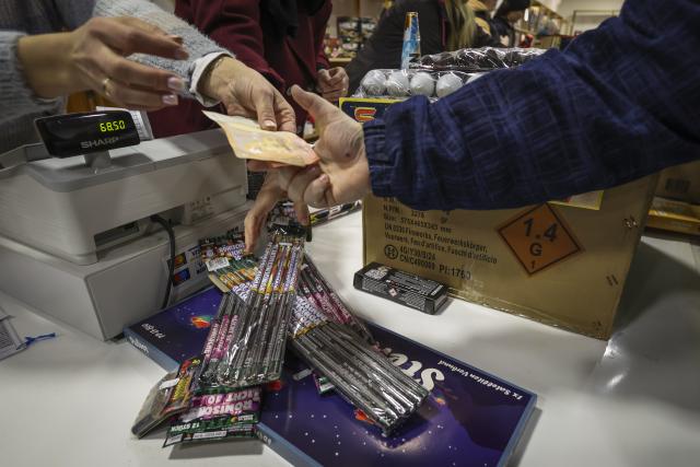 29 December 2025, Hamburg: The first customers check out during a special sale of fireworks, firecrackers and rockets in the clubhouse of a shooting club in Hamburg-Harburg. The sale of New Year's Eve fireworks begins today in Germany. Photo: Christian Charisius/dpa