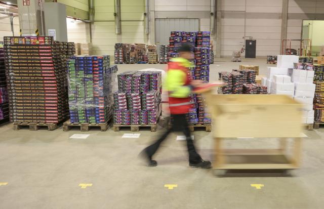 29 December 2025, Bremen, Bremerhaven: An employee collects goods at the start of sales of New Year's Eve fireworks at Comet Feuerwerk. The sale of New Year's Eve fireworks begins today in Germany. Photo: Focke Strangmann/dpa